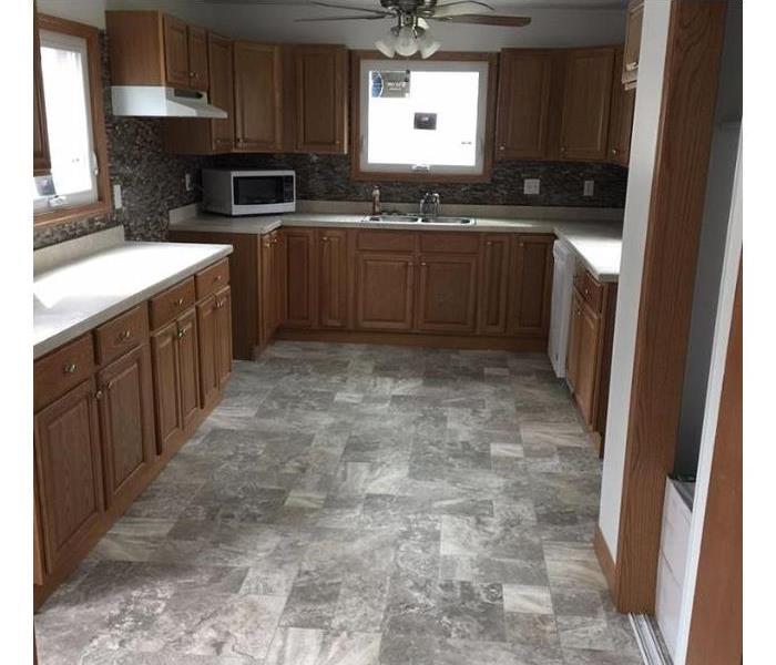 kitchen with new floors, cabinets, and appliances 