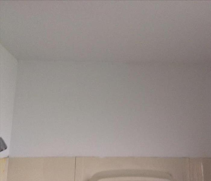 clean bathroom wall and ceiling