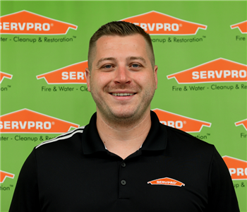 man in front of backdrop